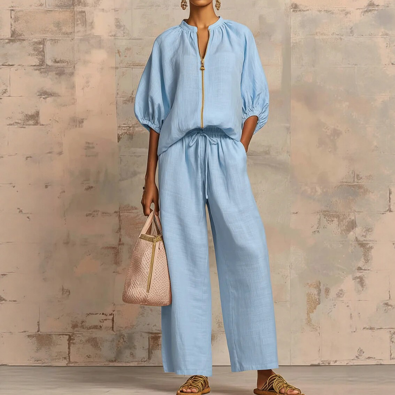 Conjunto mujer elegante con blusa de cremallera y pantalón fluido