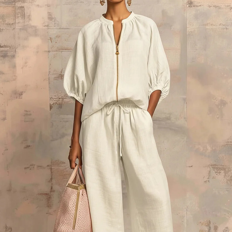 Conjunto mujer elegante con blusa de cremallera y pantalón fluido
