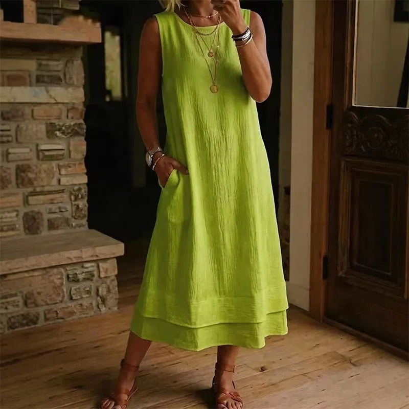 Vestido midi mujer sin mangas con bolsillos y bajo con volante