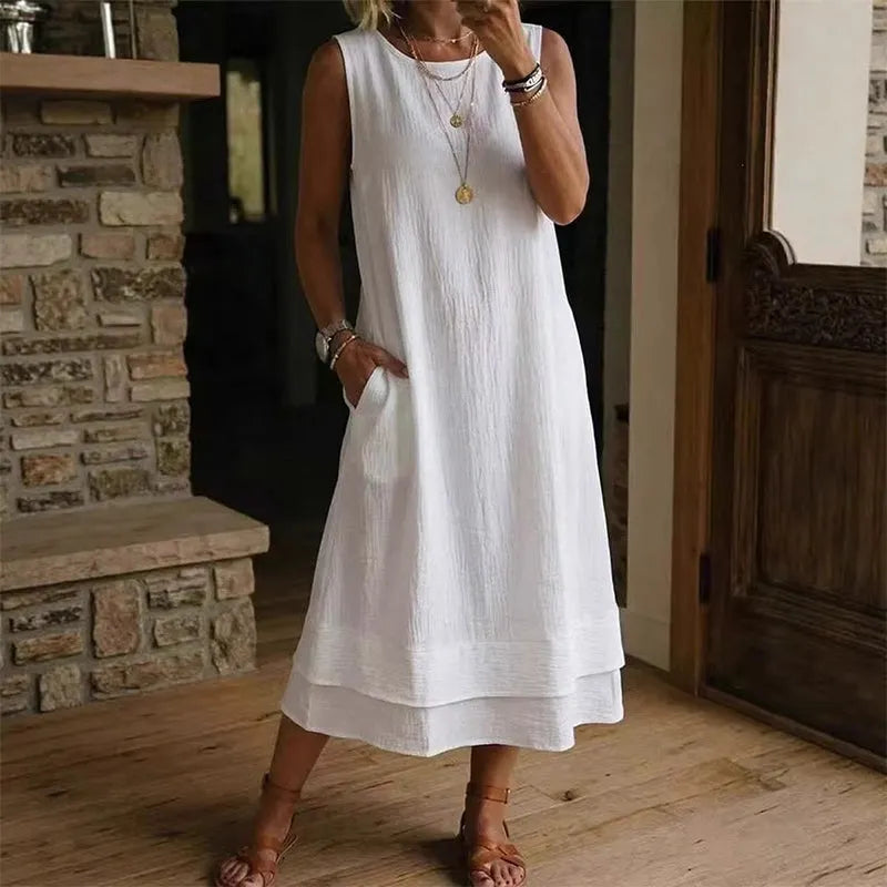 Vestido midi mujer sin mangas con bolsillos y bajo con volante