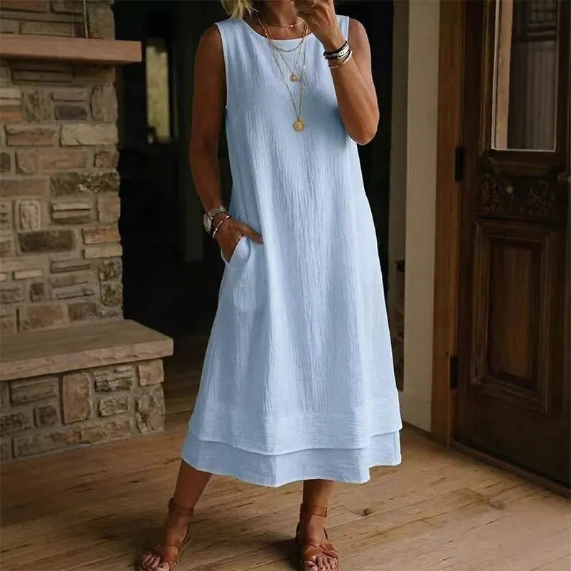 Vestido midi mujer sin mangas con bolsillos y bajo con volante
