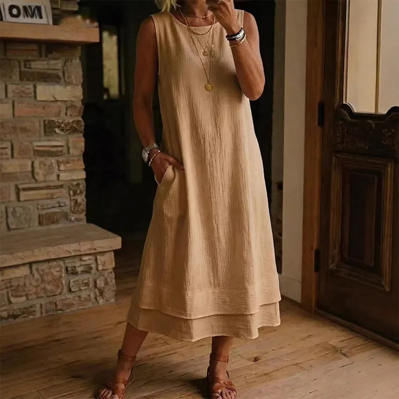 Vestido midi mujer sin mangas con bolsillos y bajo con volante