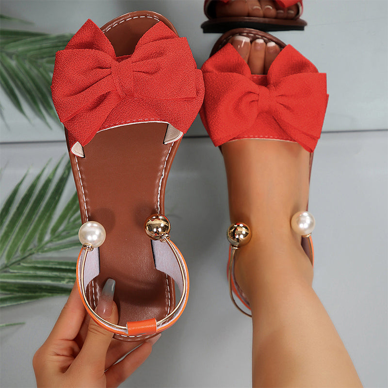 Sandalias mujer planas con lazo decorativo y detalles de perlas
