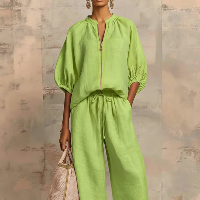 Conjunto mujer elegante con blusa de cremallera y pantalón fluido
