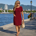 Vestido mujer texturizado con cuello redondo y bolsillos