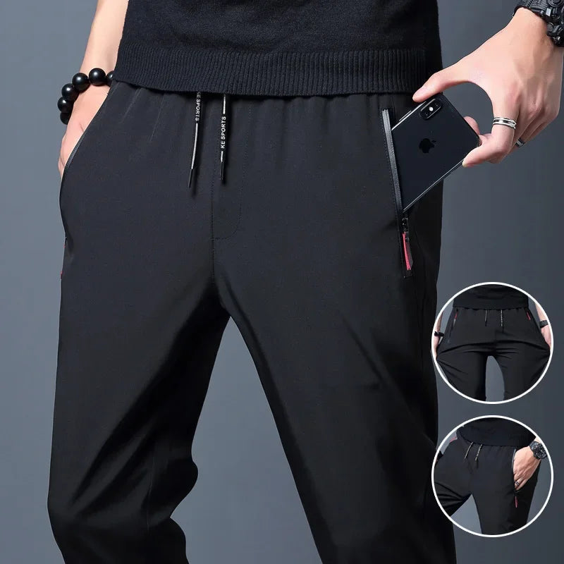 Pantalón casual hombre slim con cintura elástica y bolsillos con cremallera