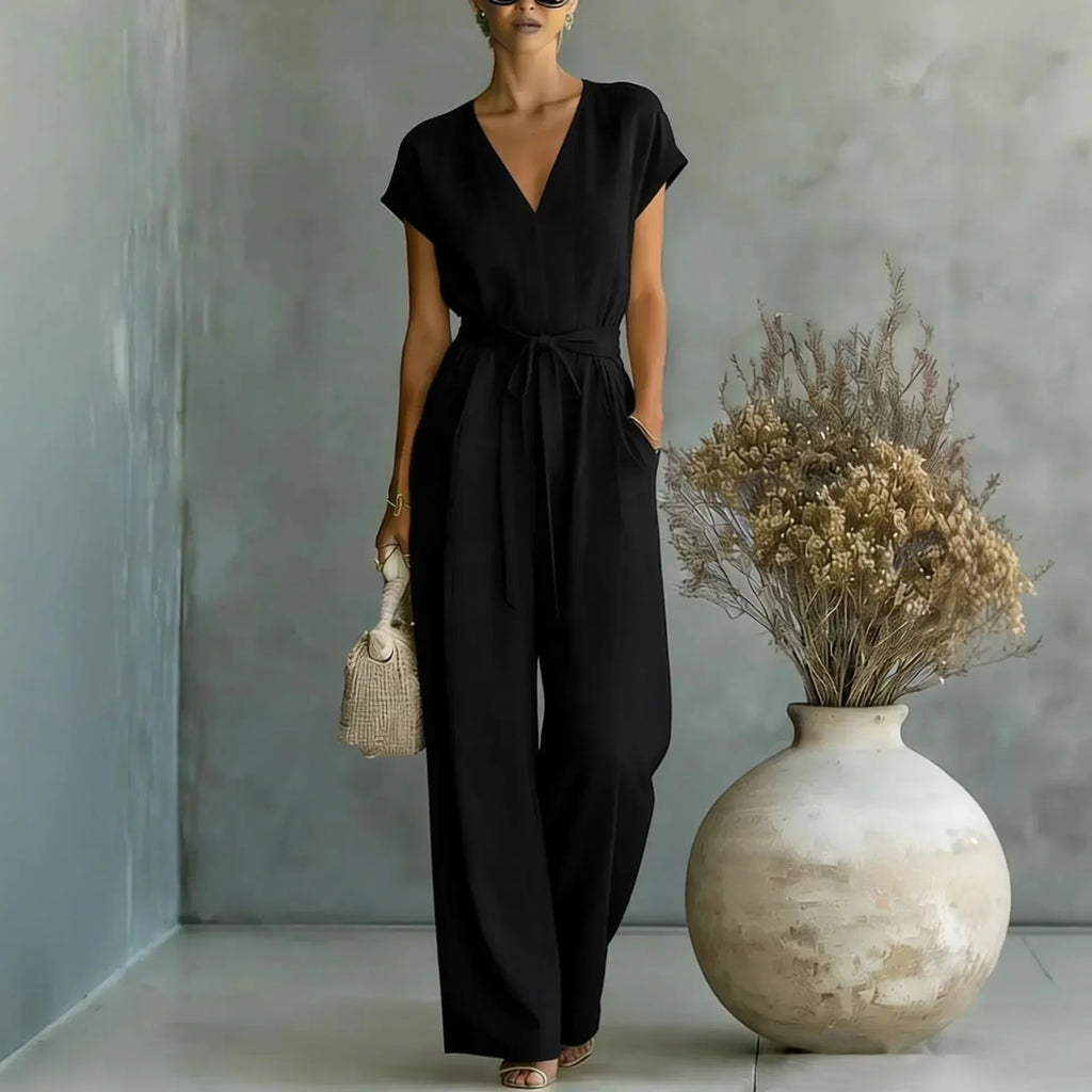 Mono mujer con escote en V cinturón y pantalón ancho casual chic