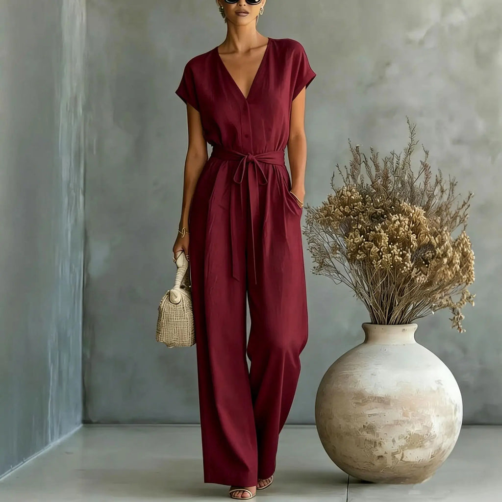 Mono mujer con escote en V cinturón y pantalón ancho casual chic