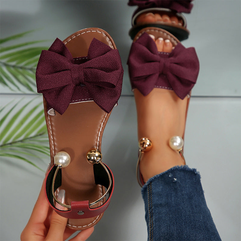 Sandalias mujer planas con lazo decorativo y detalles de perlas