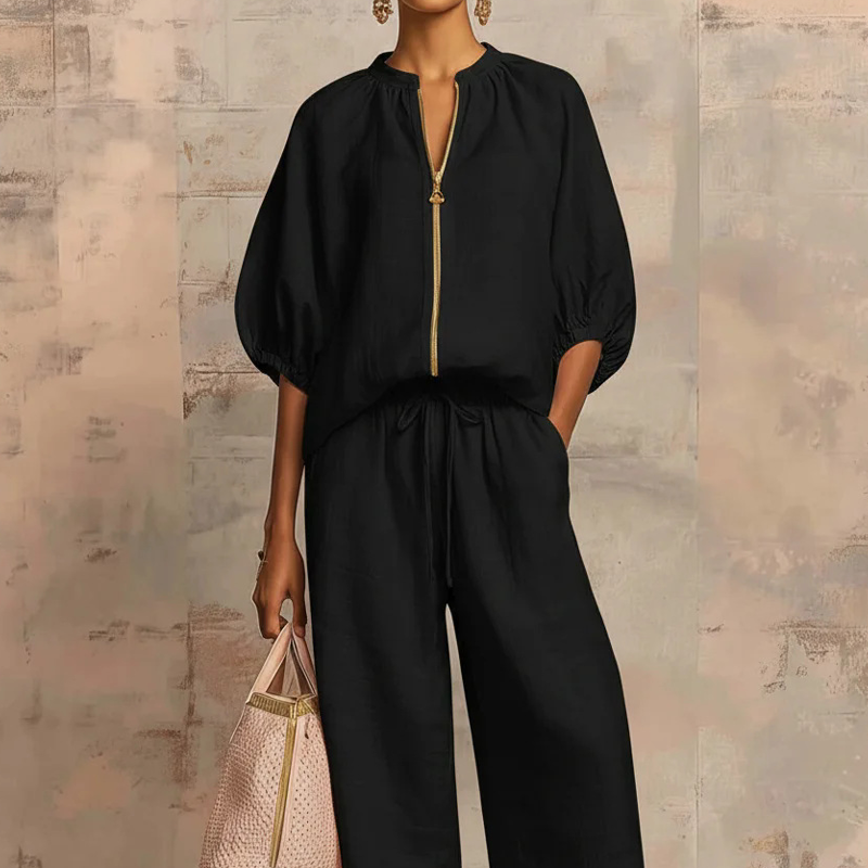 Conjunto mujer elegante con blusa de cremallera y pantalón fluido