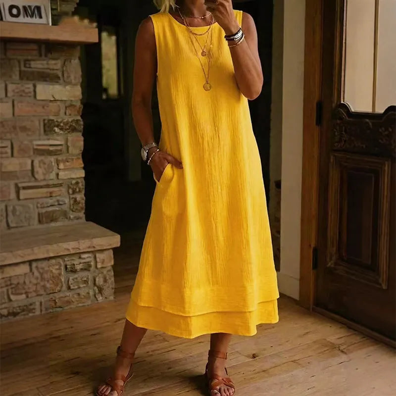 Vestido midi mujer sin mangas con bolsillos y bajo con volante