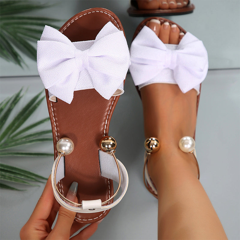 Sandalias mujer planas con lazo decorativo y detalles de perlas