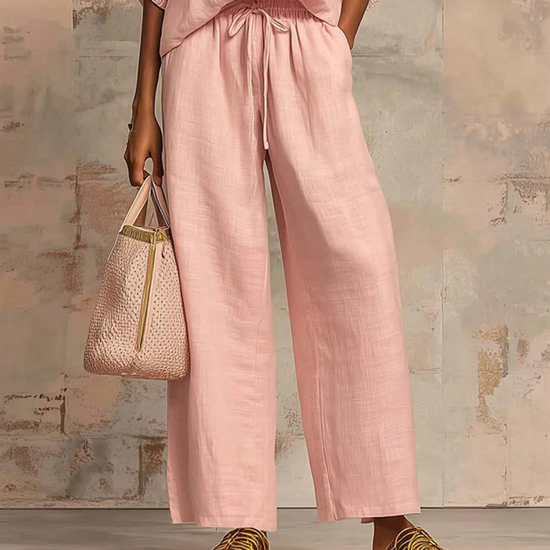 Conjunto mujer elegante con blusa de cremallera y pantalón fluido