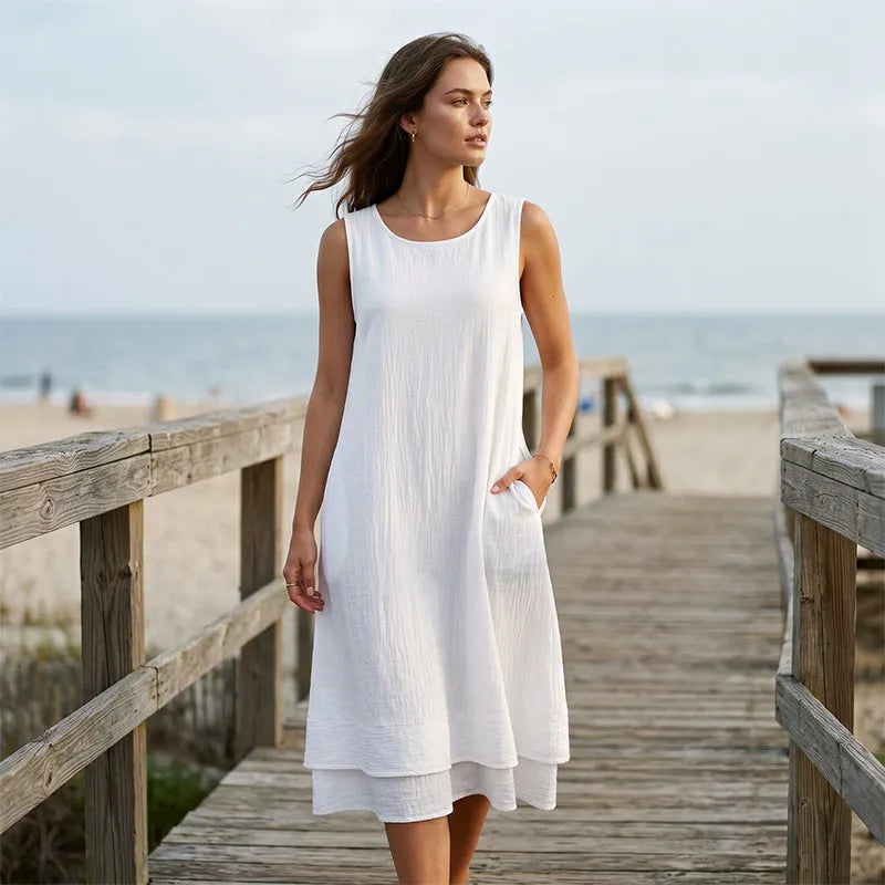 Vestido midi mujer sin mangas con bolsillos y bajo con volante