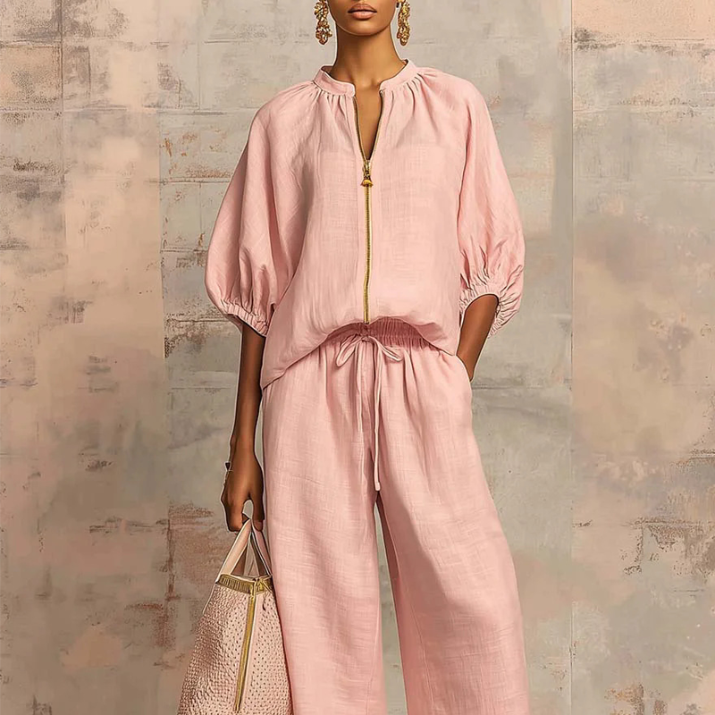 Conjunto mujer elegante con blusa de cremallera y pantalón fluido