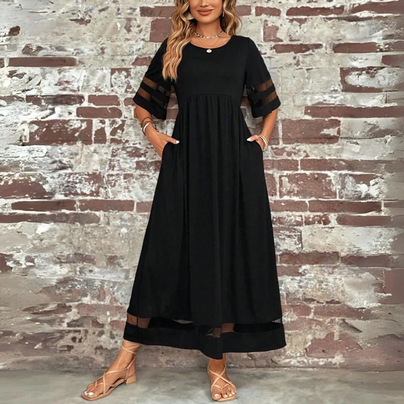 Vestido largo femenino de tejido ligero con detalles transparentes