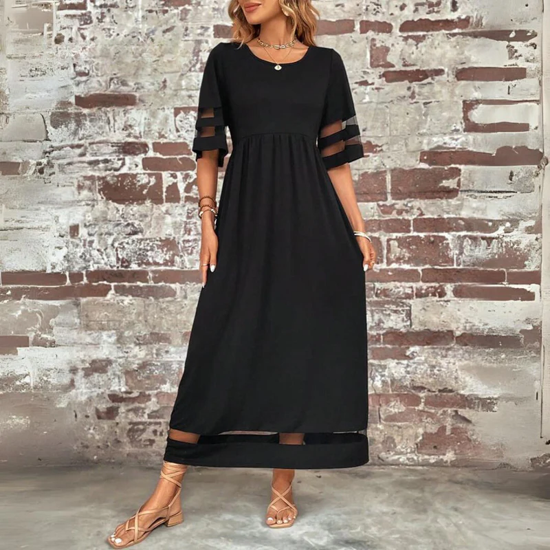 Vestido largo femenino de tejido ligero con detalles transparentes