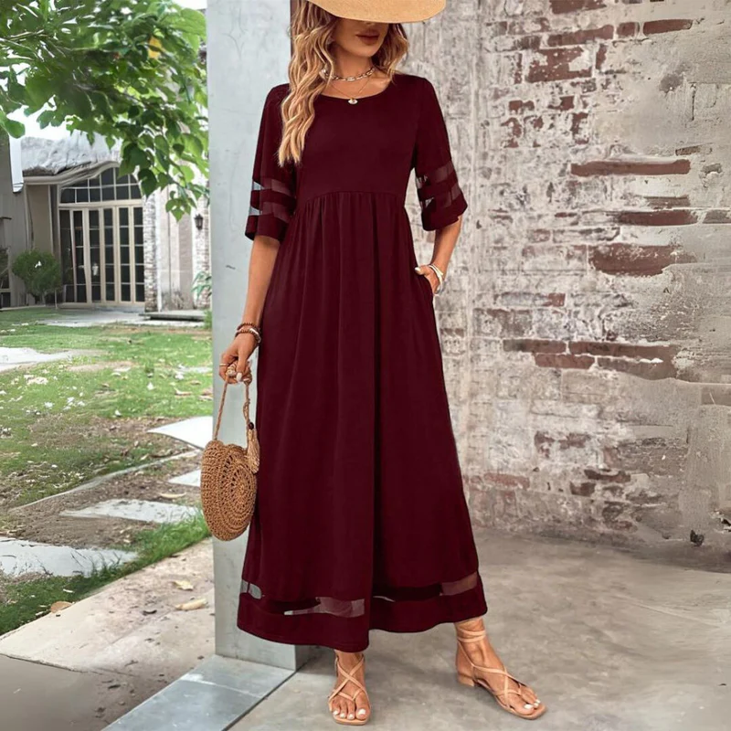 Vestido largo femenino de tejido ligero con detalles transparentes
