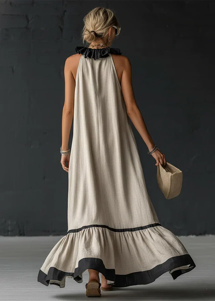 Vestido largo de mujer con volantes y cuello halter